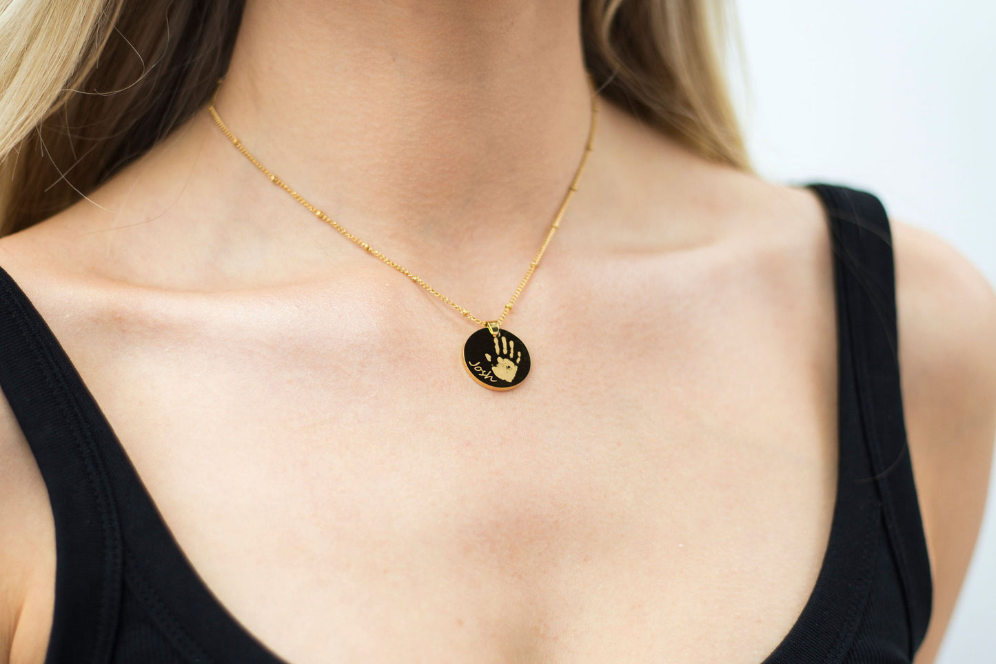 Gold circle handprint engraved necklace