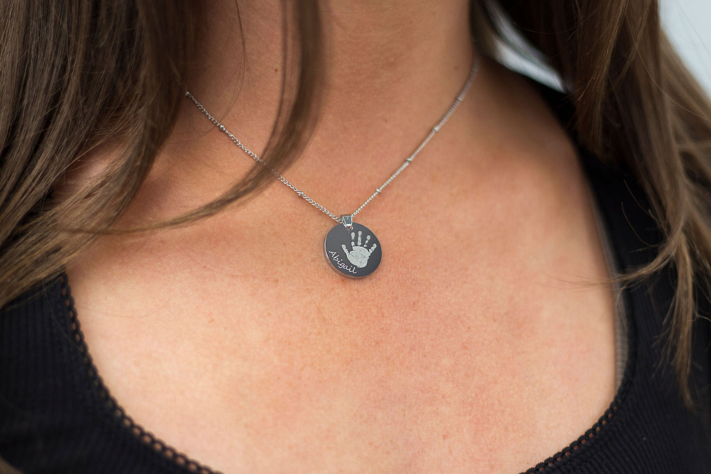 Silver circle handprint engraved necklace