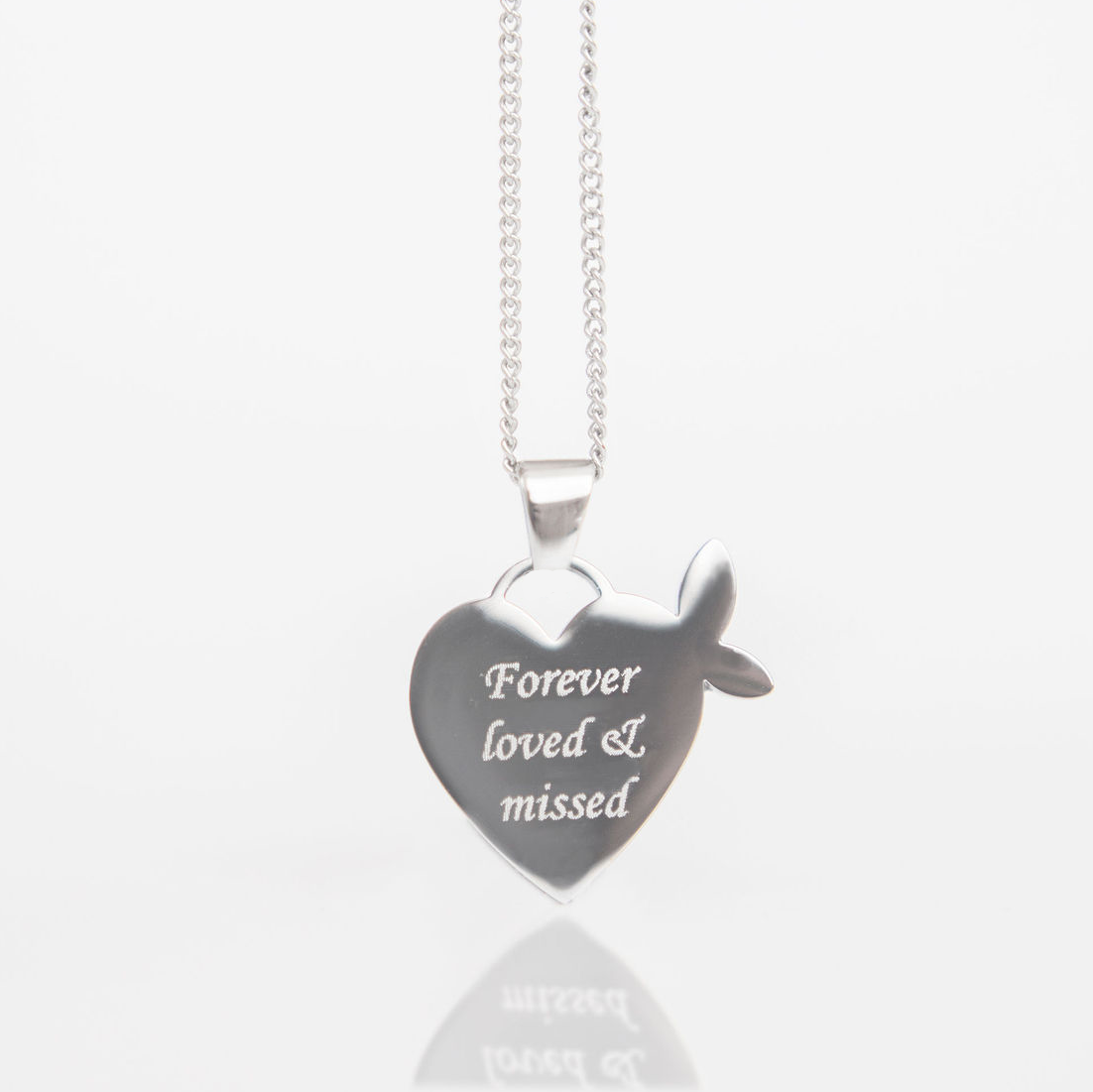 Winged heart-shaped silver pendant with 'Forever loved & missed' engraving