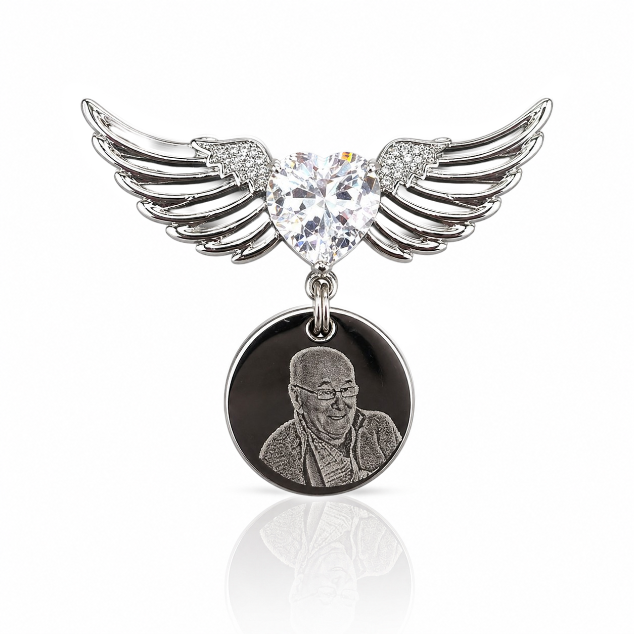 Pendant with heart-shaped crystal and wings on a white background
