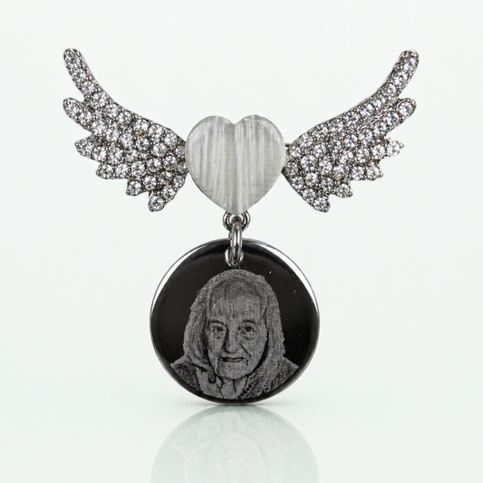 Pendant with heart and wings on a white background