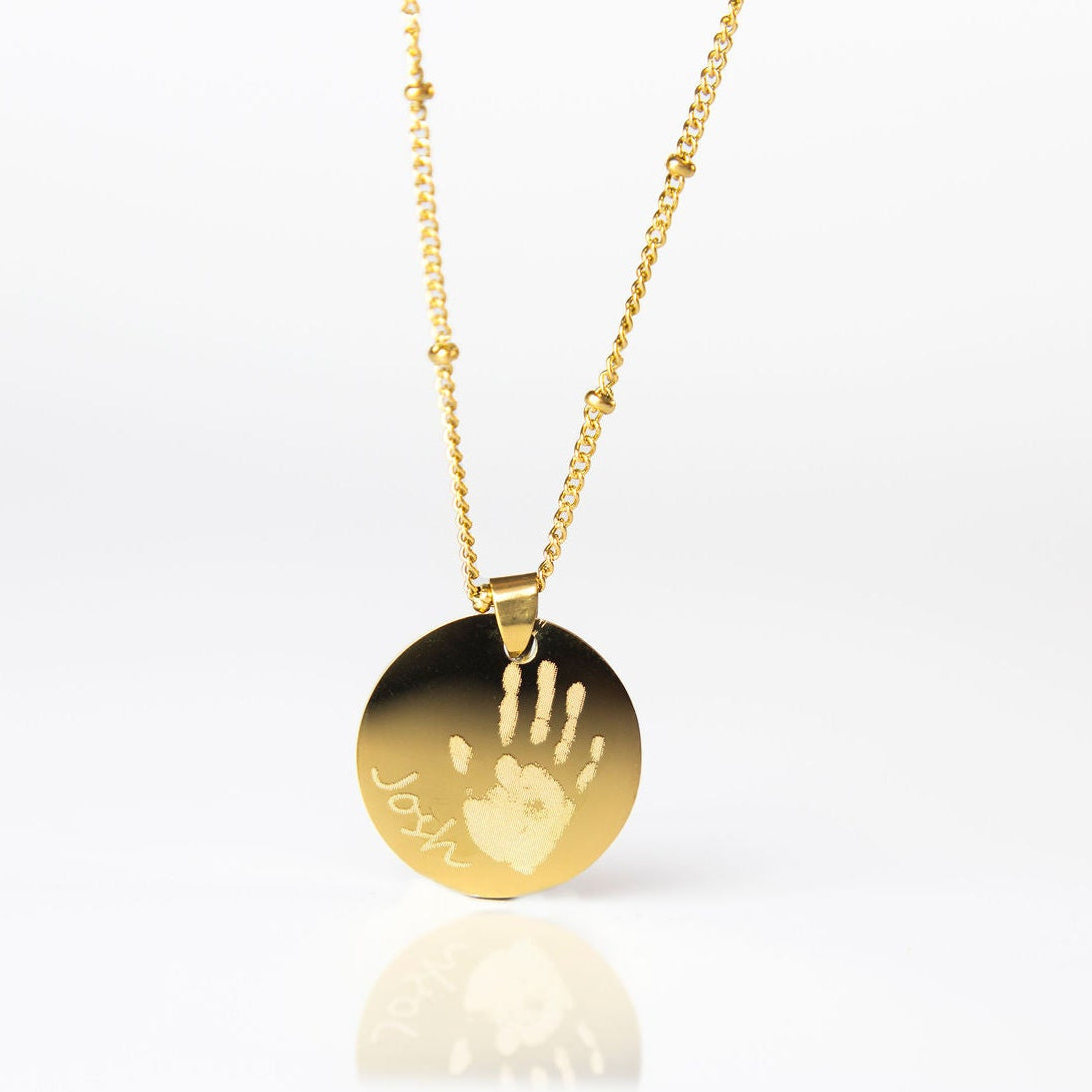 Gold circle handprint engraved necklace