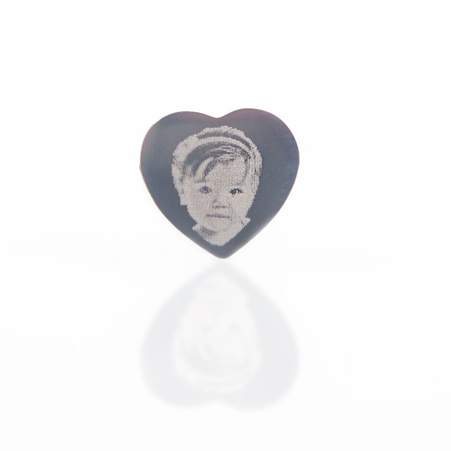 Heart-shaped object with a portrait on a white background