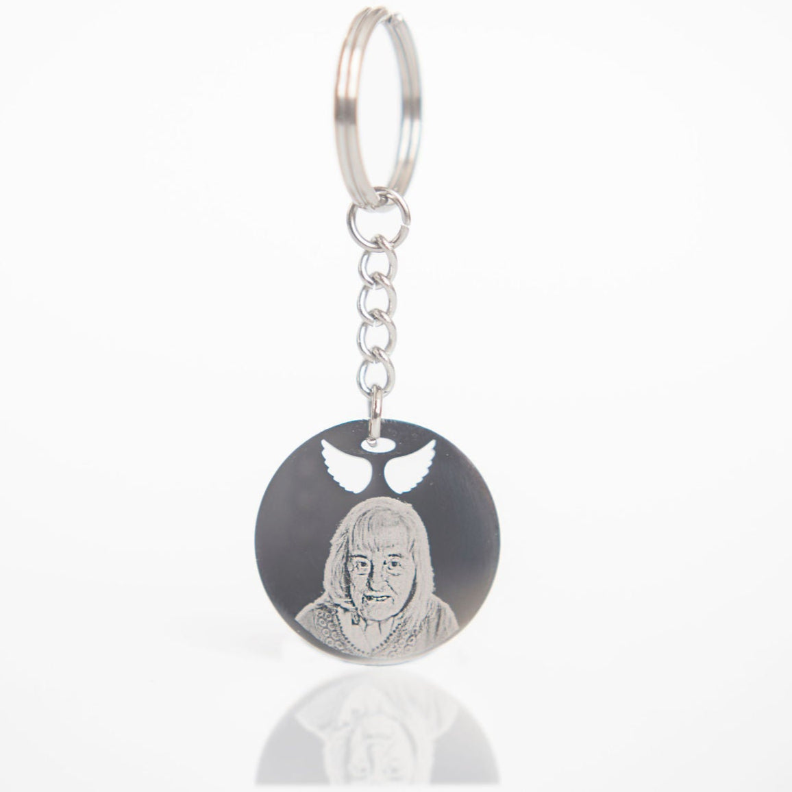 Keychain with engraved face on a white background