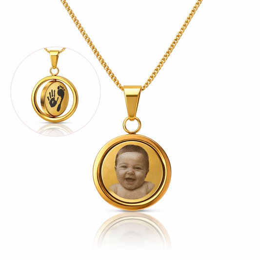 Gold necklace with round pendant featuring a child's photo on a white background