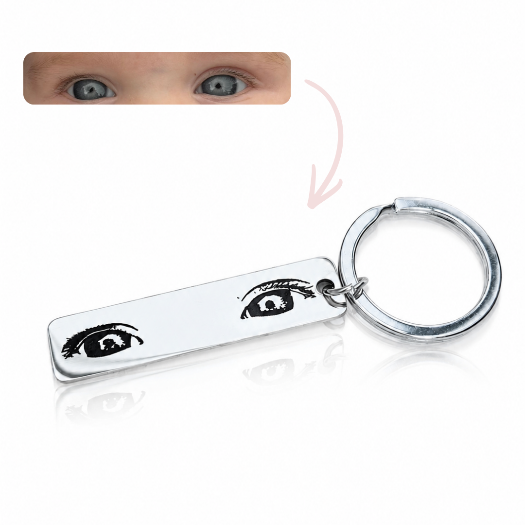 Keychain with eye engraved design on a white background