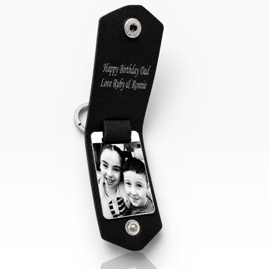 A black personalized photo keychain with a split ring, featuring a custom black-and-white photo of a father and child and the engraved text 'Happy Birthday Dad' on a white background.