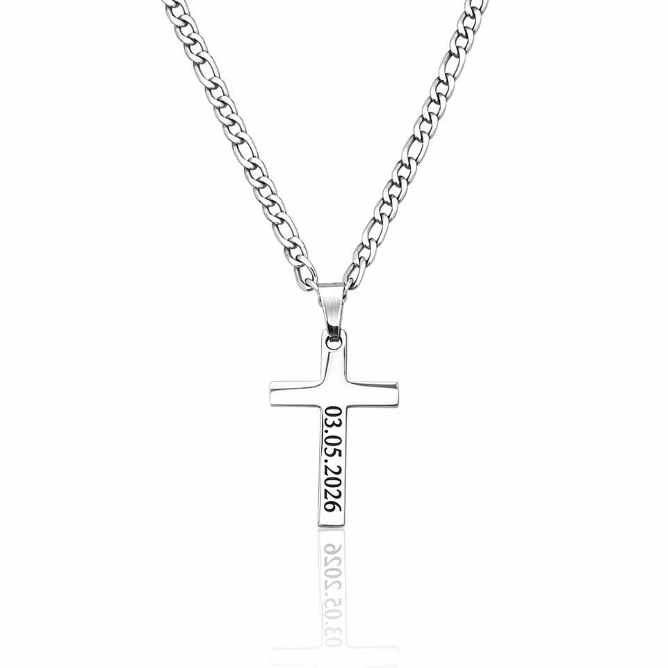 Silver cross necklace with engraved text on a white background