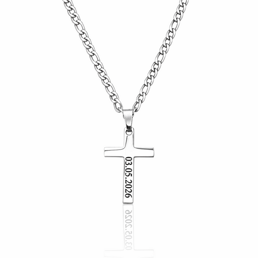 Silver cross necklace with engraved text on a white background
