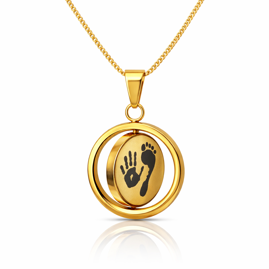Gold necklace with a pendant featuring a hand and foot design on a white background